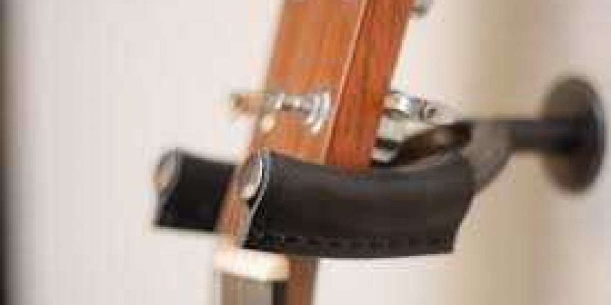 Secure and Stylish: The Ultimate Guitar Holder for Your Wall